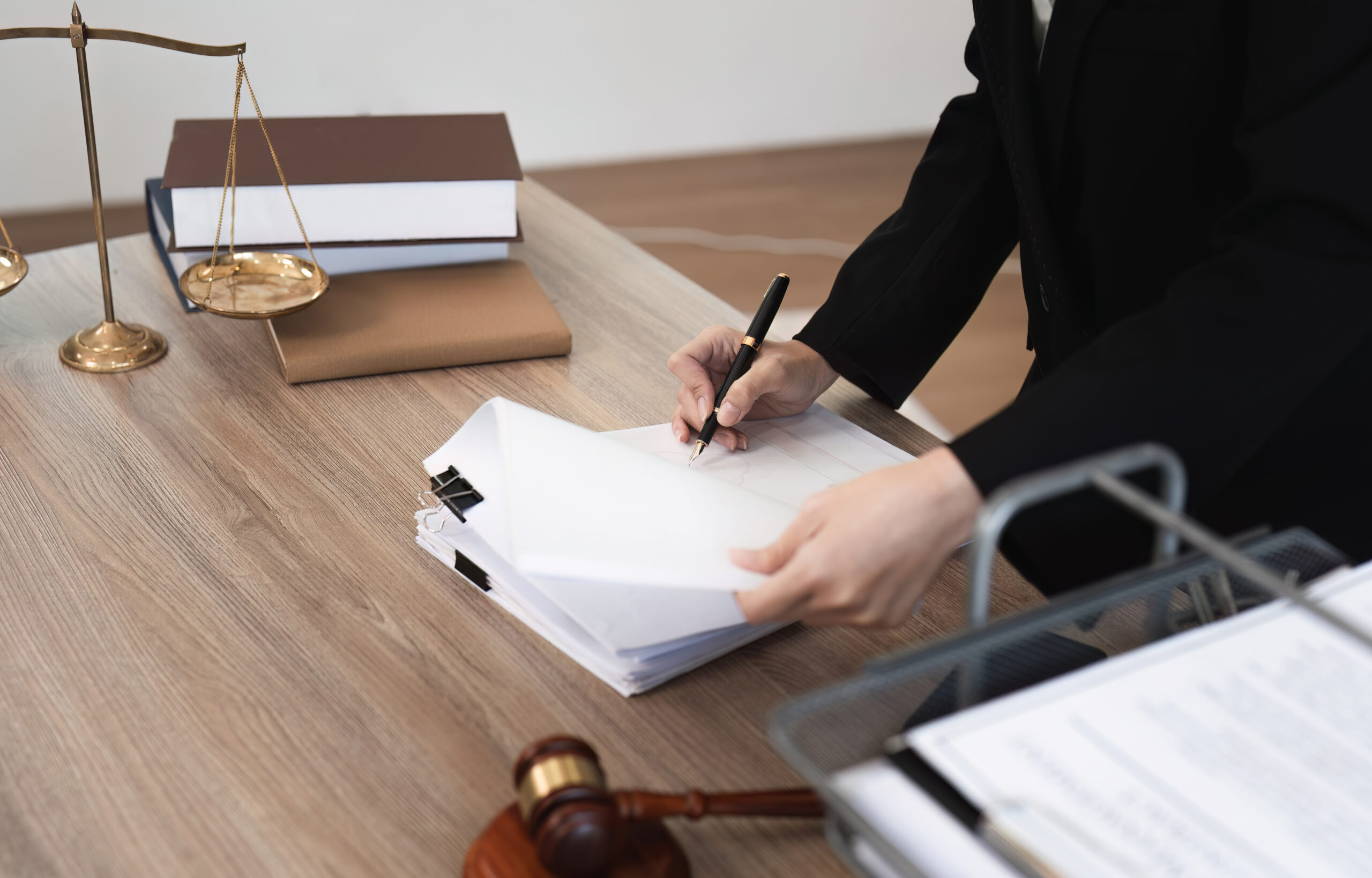 Professional Female Lawyer Reviewing Legal Contract Documents in Modern Office Setting